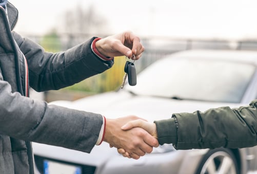 two-people-reaching-an-agreement-about-a-car-sale-royalty-free-image-1665671206